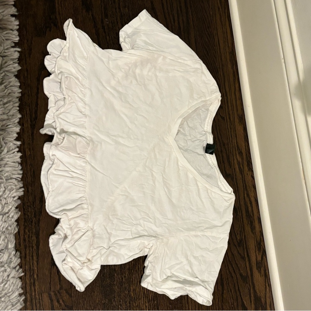Target Wild Fable, Size M, white v-neck with wide bottom and ruffles.